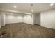 Spacious finished basement featuring neutral carpeting and recessed lighting, perfect for a Gathering room or recreation area at 15144 Bentfield Ct, Fishers, IN 46037