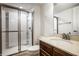 Bathroom featuring a glass-enclosed shower, wood vanity with a mirror, tile floors and modern fixtures at 15144 Bentfield Ct, Fishers, IN 46037