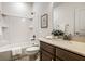 Well-lit bathroom with a shower-tub combo, vanity with sink, and a framed mirror at 15144 Bentfield Ct, Fishers, IN 46037