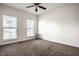 Empty bedroom with carpet floors, two windows, and a ceiling fan at 15144 Bentfield Ct, Fishers, IN 46037