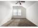 Bedroom with sloped ceiling, large window, carpet floors, and neutral paint at 15144 Bentfield Ct, Fishers, IN 46037