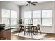 Charming breakfast nook with wood floors, a modern table, and lots of natural light at 15144 Bentfield Ct, Fishers, IN 46037