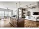 Open concept kitchen with island flows into dining and living spaces, perfect for entertaining at 15144 Bentfield Ct, Fishers, IN 46037