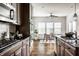 Spacious kitchen with granite countertops, stainless steel appliances, and adjacent breakfast nook with dining table at 15144 Bentfield Ct, Fishers, IN 46037