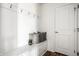 Mudroom with bench, storage, hooks, and wood flooring at 15144 Bentfield Ct, Fishers, IN 46037