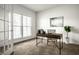 Bright home office with ample natural light, modern desk, comfortable chair, and stylish decor at 15144 Bentfield Ct, Fishers, IN 46037