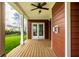 Exterior side view of a covered patio overlooking a lush green lawn at 15144 Bentfield Ct, Fishers, IN 46037