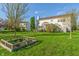 The home has a large, level yard with mature trees and screened-in porch at 158 Bloomfield Ln, Westfield, IN 46074