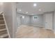 Finished basement with a neutral color palette, carpeted stairs and a window for natural light at 158 Bloomfield Ln, Westfield, IN 46074