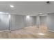 Open basement features wood floors, bright paint, recessed lighting and access to other areas at 158 Bloomfield Ln, Westfield, IN 46074