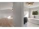 An elegant bathroom featuring a soaking tub and a dark vanity with a marble countertop at 158 Bloomfield Ln, Westfield, IN 46074