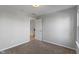 Carpeted bedroom features a door to the upstairs, a single window, and recessed lighting at 158 Bloomfield Ln, Westfield, IN 46074