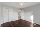 This bedroom offers neutral paint, wood floors, closet space and access to the second floor at 158 Bloomfield Ln, Westfield, IN 46074