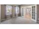 Carpeted bedroom with natural light, neutral paint, and french doors at 158 Bloomfield Ln, Westfield, IN 46074