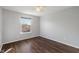 Cozy bedroom features wood floors, neutral paint and a window with a view of the outdoors at 158 Bloomfield Ln, Westfield, IN 46074