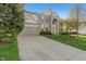 Beautifully landscaped home with a two-car attached garage and a large driveway at 158 Bloomfield Ln, Westfield, IN 46074