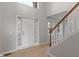 Bright foyer with hardwood floors and a staircase at 158 Bloomfield Ln, Westfield, IN 46074