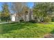 Beautifully landscaped home with a two-car attached garage and a well-manicured lawn at 158 Bloomfield Ln, Westfield, IN 46074