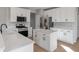 Beautiful kitchen with white cabinets, stainless steel appliances, quartz countertops, and kitchen island at 158 Bloomfield Ln, Westfield, IN 46074
