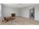 Bright and airy living room featuring a fireplace, ceiling fan, and large windows at 158 Bloomfield Ln, Westfield, IN 46074