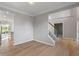 Open-concept living room with access to the kitchen and staircase at 158 Bloomfield Ln, Westfield, IN 46074