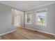 Sun-filled living room with hardwood floors, neutral paint and crown molding at 158 Bloomfield Ln, Westfield, IN 46074