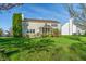 Back of home featuring a screened-in porch and lovely outdoor entertainment area at 158 Bloomfield Ln, Westfield, IN 46074