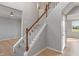 Carpeted staircase with wood railing and white risers at 158 Bloomfield Ln, Westfield, IN 46074
