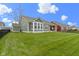 Large backyard with view of home and neighboring properties at 1747 Wellpark Dr, Westfield, IN 46074