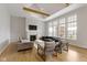 Bright living room features vaulted ceilings, exposed beams, large windows, a fireplace, and an open floor plan at 1747 Wellpark Dr, Westfield, IN 46074