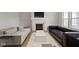Well-appointed living room featuring two sofas, a modern fireplace, and warm hardwood flooring for a cozy atmosphere at 1747 Wellpark Dr, Westfield, IN 46074