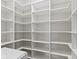 Spacious walk-in closet featuring custom built-in shelving at 1747 Wellpark Dr, Westfield, IN 46074