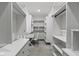 This walk-in closet offers a desk, shelving units, drawers, and hanging rods at 1747 Wellpark Dr, Westfield, IN 46074