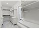 This walk-in closet has built-in cabinets, shelves, and clothes racks at 1747 Wellpark Dr, Westfield, IN 46074