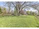 Expansive backyard with mature trees offering ample space for recreation and landscaping opportunities at 1850 Cruft St, Indianapolis, IN 46203