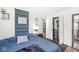 A bedroom features a full bed, closet, nightstand, and a doorway leading to another room at 1850 Cruft St, Indianapolis, IN 46203