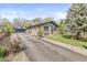 Charming stone home with detached garage, long driveway, and well-maintained landscaping at 1850 Cruft St, Indianapolis, IN 46203