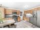 Well-appointed kitchen with stainless steel appliances and wood cabinets at 1850 Cruft St, Indianapolis, IN 46203