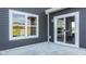 A backyard patio has sliding doors to access indoor with window to view outdoor scenery at 187 Luna Pl, Shelbyville, IN 46176