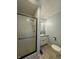 Bright bathroom featuring tiled flooring, shower, and modern sink at 1873 W 950 S, Pendleton, IN 46064