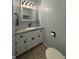 Well-lit powder room features a marble countertop and modern fixtures at 1873 W 950 S, Pendleton, IN 46064