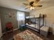 Cozy bedroom with bunk beds, colorful rug, and playful decor, perfect for a room at 1873 W 950 S, Pendleton, IN 46064