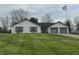 Charming home with lush green lawn, brick accents, and attached two-car garage at 1873 W 950 S, Pendleton, IN 46064