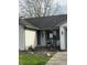 Inviting front porch with rocking chairs, brick accents, and cozy lighting at 1873 W 950 S, Pendleton, IN 46064
