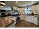 Modern kitchen with stainless steel appliances, light countertops, and lots of natural light at 1873 W 950 S, Pendleton, IN 46064