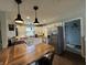 Beautiful kitchen with wood countertops, stainless steel appliances, and eat-in counter seating at 1873 W 950 S, Pendleton, IN 46064
