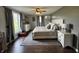 Spacious main bedroom with wood floors, neutral color scheme, and comfortable furnishings for a relaxing retreat at 1873 W 950 S, Pendleton, IN 46064