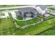 Aerial view of a house featuring a fenced backyard, patio, and playset, situated in a well-maintained neighborhood at 1979 Lunenburg Dr, Westfield, IN 46074