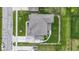 Aerial view of a well-maintained home with a neutral roof, green lawns and landscaping, and an expansive driveway at 1979 Lunenburg Dr, Westfield, IN 46074