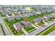 An elevated view of houses nestled in a community near a picturesque pond, enhanced by manicured lawns and landscaping at 1979 Lunenburg Dr, Westfield, IN 46074